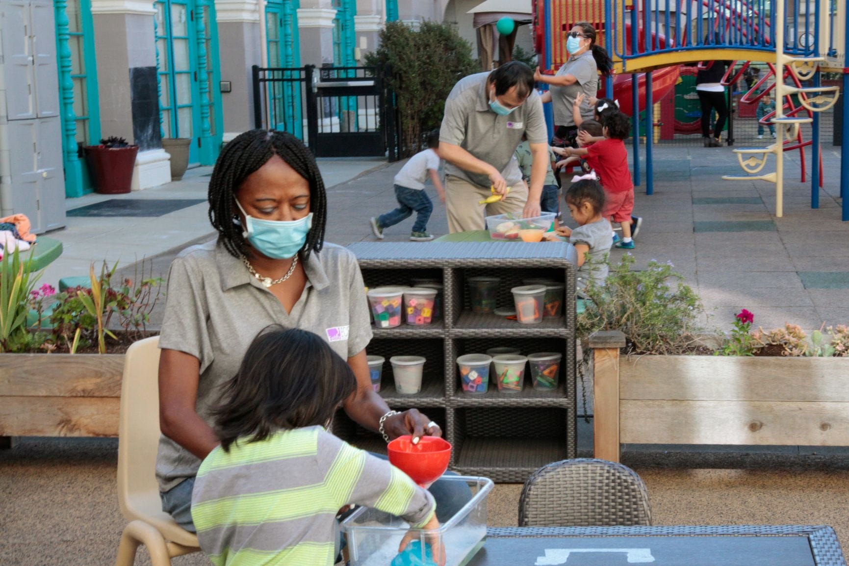 A child educator is playing with a child one-on-one.