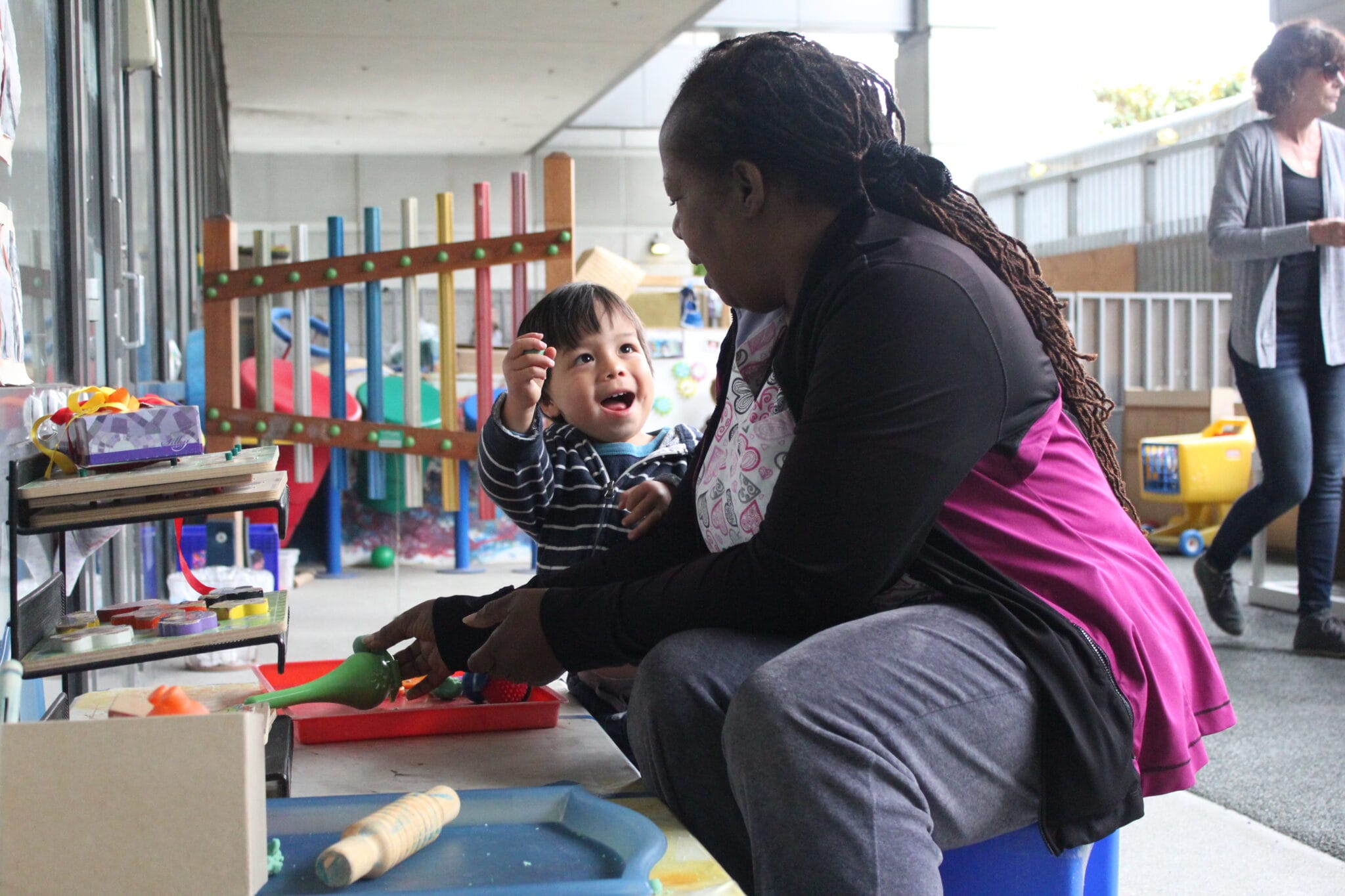 Early educator doing an activity with a child.