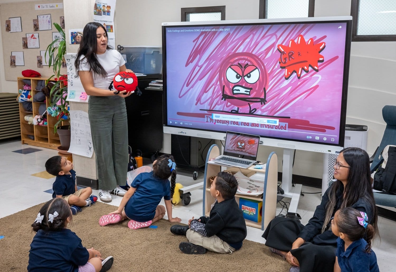 A teacher explains emotions to a group of students.